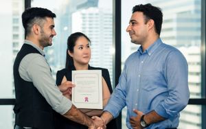 A male professional receiving a CCIE certification.