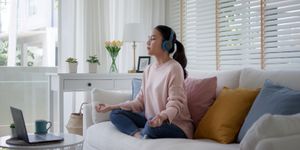 Young professional using a meditation app signifying mental health technology